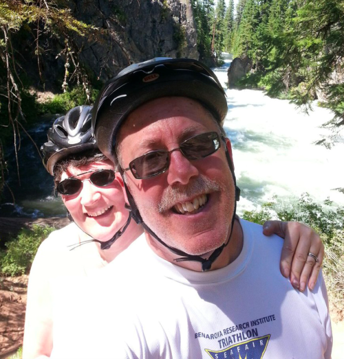 Scott and his wife riding a bike